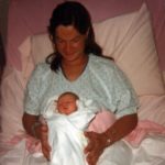 Diane Cole holds her infant daughter, Jessica, in the hospital bed. (9/4/1977)