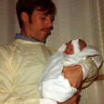 Doug holds his infant daughter Jessica on her birth day. (9/4/1977)