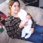 Cole gets held by his Aunt Jessica at the Cole home in Bridgeport, Michigan. (3/15/1998)