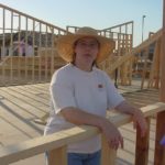 Jessica staring out of the initial framing for their new home in Gilbert, AZ. (7/20/2001)