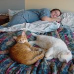 Jessica sleeps alongside her kitties, Cheetoe and Olly. (1/20/2002)