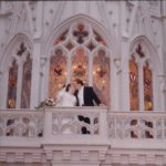 Newlyweds Andrew and Jessica Green pose on the backside of Cinderella's Castle, at Walt Disney World. (2/2/2002)