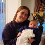 Jessica holds her new baby brother, Noah. (1/17/2004)