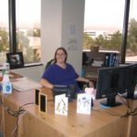 Jessica sits at her desk at the Maricopa County Community Colleges District Office. (1/20/2006)