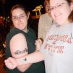 Jessica and Amy show off their temporary tattoos at Santa's Theme Park in Chandler. (11/19/2006)