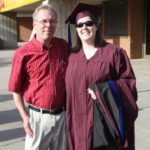 Jessica poses with her father after her Master's graduation ceremony. (5/10/2008)