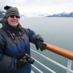 Jessica poses in front of Hubbard Glacier, camera in hand, during an Alaskan cruise. (6/10/2008)