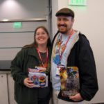 Jessica and Andrew pose with autographed items from the Transformers convention, Botcon 2009. Jessica was waiting for David Kaye, while Andrew was waiting for Peter Cullen. (5/30/2009)