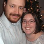 Andrew and Jessica pose together in front of the 2009 Christmas tree. Jessica just had her hair cut short. (12/11/2009)