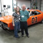 Jessica poses with her father Doug in front of a replica of the General Lee car from Dukes of Hazard at the Corvette Museum. (4/13/2011)