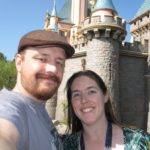 Andrew and Jessica pose in front of Sleeping Beauty's castle at Disneyland. (10/22/2011)