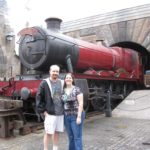 Andrew and Jessica pose in front of the Hogwarts Express at Universal Islands of Adventure (1/27/2012)