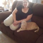 Jessica poses with her cat Tumbleweed on the coach. (4/9/2014)