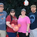 Mason, Amy, Jessica, and Andrew pose in front of a giant Christmas tree found at Epcot, Walt Disney World. (12/15/2016)