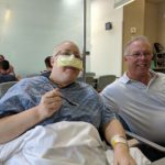 Jessica, now with patio privileges, eats some frozen yogurt while her dad Doug is beside her at the Mayo Clinic. (6/2/2018)